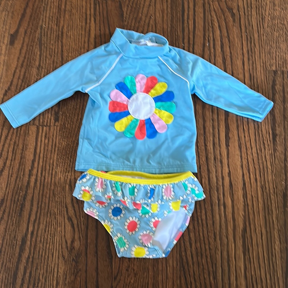 Flower power swim suit rash guard and ruffled bottoms